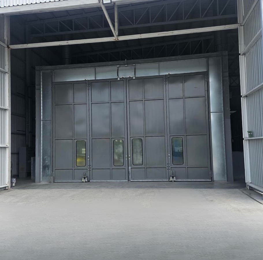 Component moving through sand blasting and the paint booth