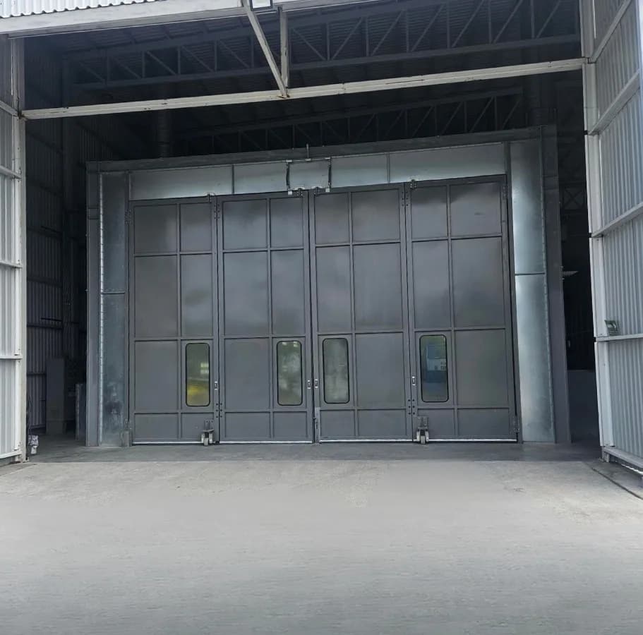 Component moving through sand blasting and the paint booth